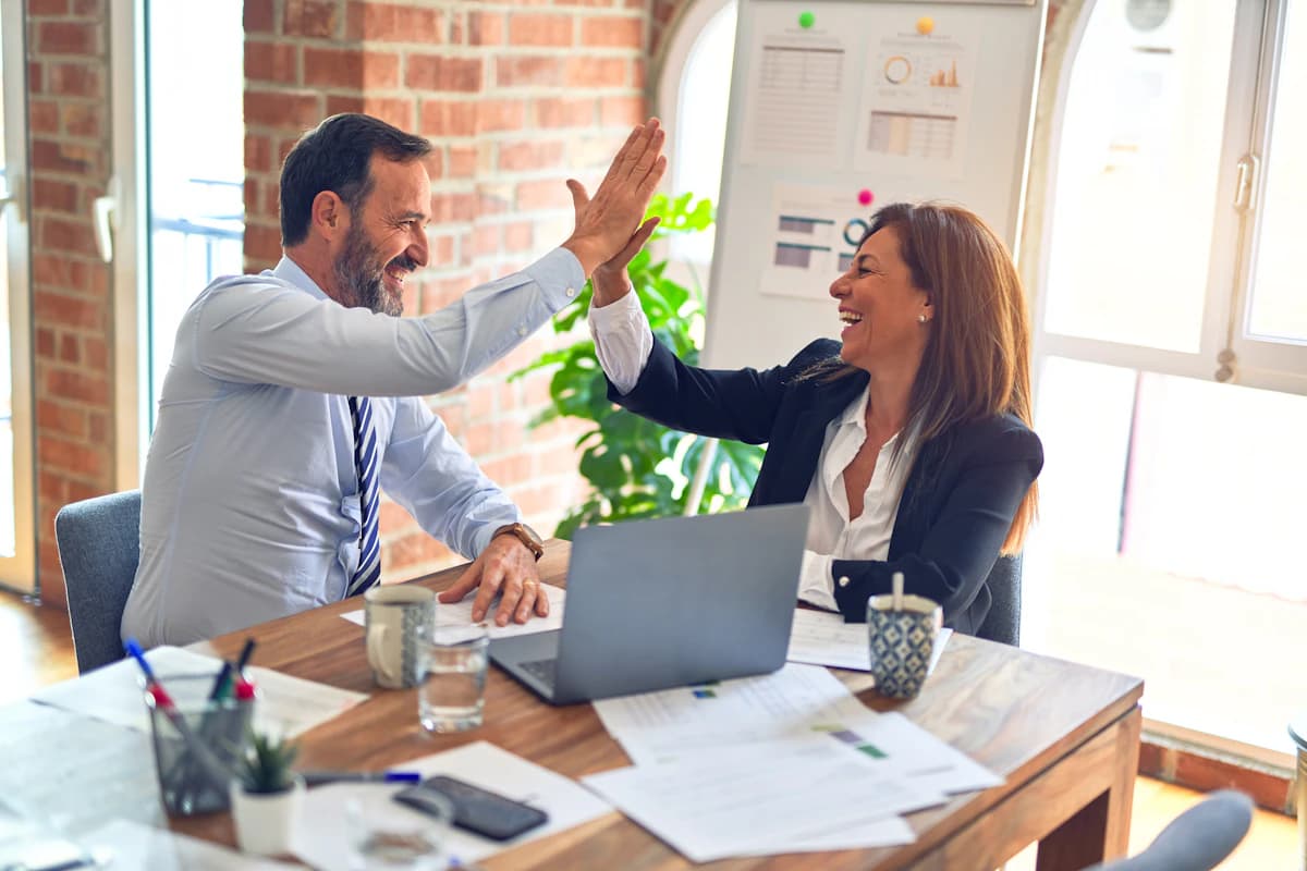 Business owner choosing a Shopify development agency in 2026 reviewing portfolio and pricing